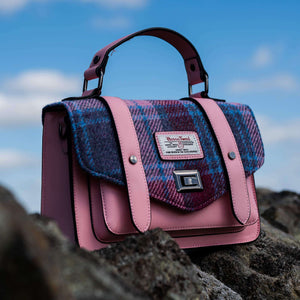 Pink Harris Tweed faux leather bag with a pink and blue tartan fabric flap.