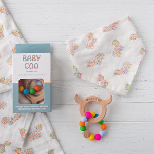Highland cow Baby Coo shaped teething ring with a matching baby dribble bib. 