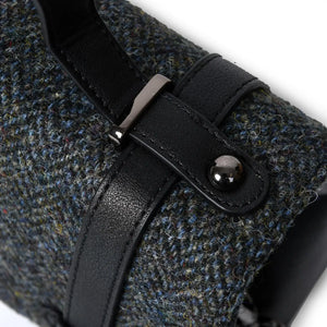 A close up of the Harris Tweed fabric on the handbag and also showing the top handle. 