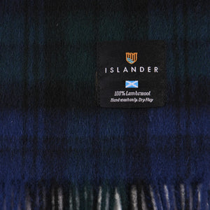 Close up of the 100% lambswool label that is attached to the scarf.