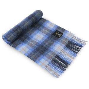 The Islander Blue Tartan Lambswool Scarf rolled up at one end.