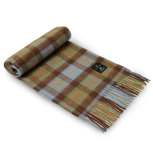 The Islander Chestnut and Blue Tartan Lambswool Scarf with one end rolled up.
