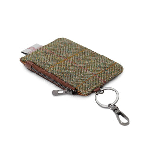 Side view of the Islander Chestnut Herringbone Harris Tweed Zip Card Wallet showing the attached keychain.