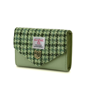Side image of the Green Dogtooth Harris Tweed Purse showing the green PU leather.