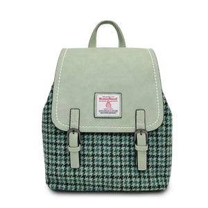 Green Harris Tweed Backpack with a Dogtooth pattern on the front and made from mint synthetic leather. 