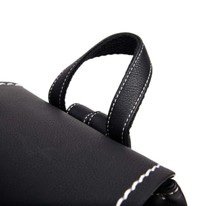 Close up of the top handles on the Islander Jura Backpack Black Herringbone. 