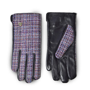 A pair of ladies Harris Tweed Violet Dogtooth Gloves one showing the PU leather body.