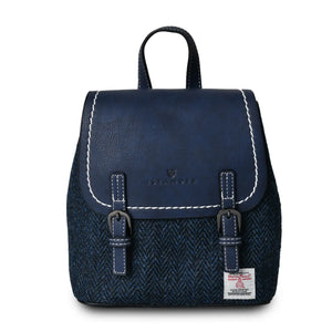 Harris Tweed backpack made from dark blue navy PU leather and finished with a navy herringbone Harris Tweed fabric.