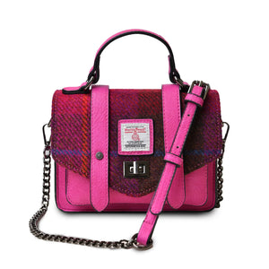 The Islander red Tartan Harris Tweed Mini Satchel with the chain shoulder strapped draped across the front. 