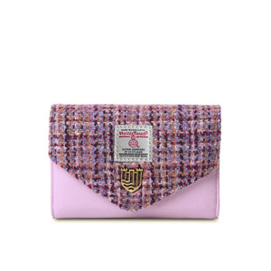 An image of a violet dogtooth Harris tweed purse with sturdy PU leather base and a spacious interior. The classic pattern and rich color make it a stylish and practical accessory for any outfit.