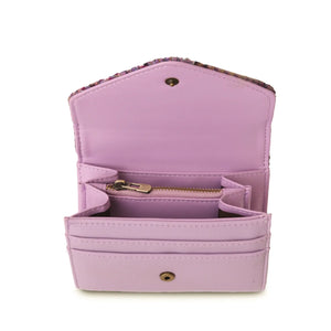 An image of the inside of a violet dogtooth Harris tweed purse, showcasing the violet PU leather lining and a zipped compartment. The spacious interior offers plenty of room for storing all of your daily essentials, and the zipped compartment is perfect for keeping valuables safe and secure. The classic dogtooth pattern on the exterior of the purse is visible through the open top.