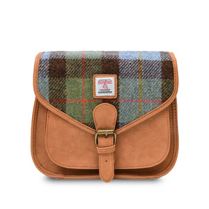 The bag is made of durable Harris Tweed fabric, with a soft-lined interior and a removable shoulder strap.