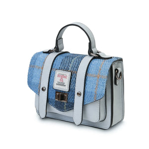 From the side the Islander Blue Tartan Harris Tweed Mini Satchel style handbag without the adjustable strap but showing the rings where it would attach.