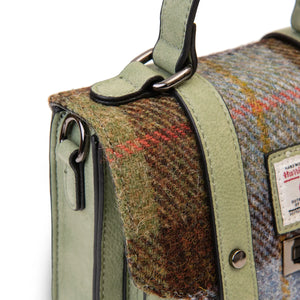 A close up of the green, blue and brown tartan on the Harris Tweed bag.