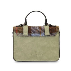 From behind the Harris Tweed Satchel style handbag in green synthietic leather and finished with tartan.