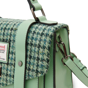 Close up of the Islander Harris Tweed Satchel showing the Green Dogtooth fabric and the removable shoulder strap. 