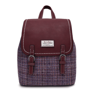 Harris Tweed backpack with a burgundy synthetic body and a Violet Mini Dogtooth Harris Tweed body. It has an authentication label stitched into the body. 