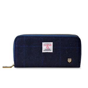 The Islander Harris Tweed Navy Tartan Purse from the front showing the genuine Harris Tweed marker and logo.