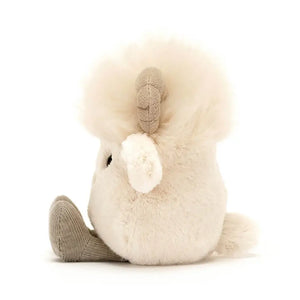 Side view of the Jellycat Amuseabean Ram with his little legs sitting out in front. 