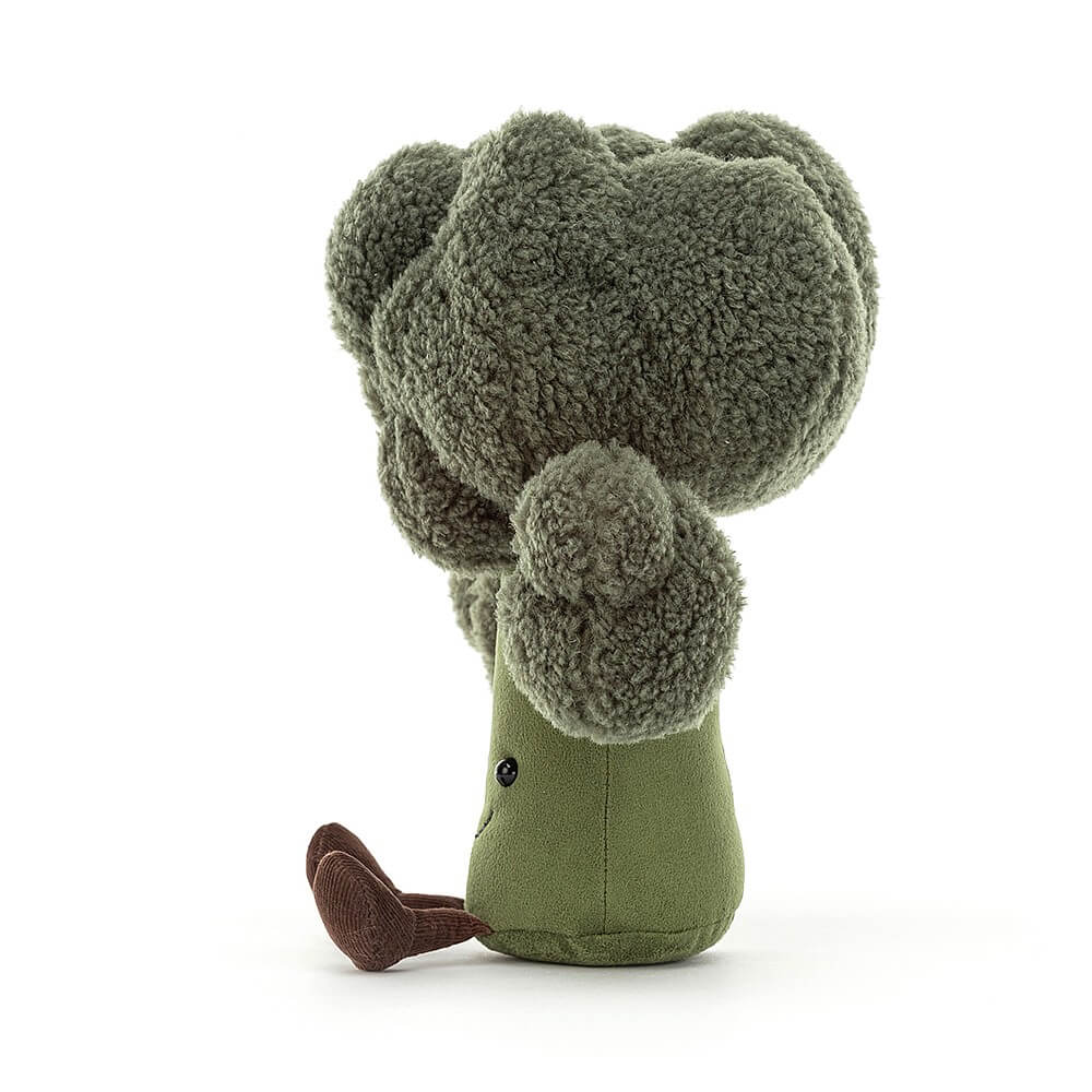 Side view of the Jellycat Amuseable Broccoli children's soft toy with little legs sticking out in front. 