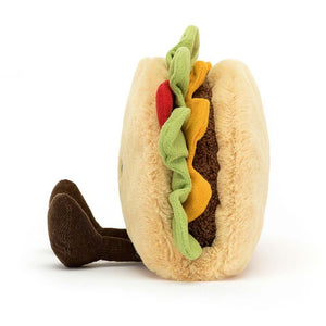 Side view of the Jellycat Amuseable Taco children's soft toy with little corduroy legs sitting out in front. 