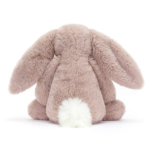 From behind the Jellycat Bashful Luxe Bunny Rose children's soft toy showing its fluffy white tail.