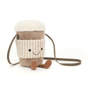 Amuseable Coffee-To-Go Bag by Jellycat, a charming coffee cup shaped bag with a cross-body strap and a zip-top lid. The bag features waggly legs, a chunky cord holder, and a jolly smile.