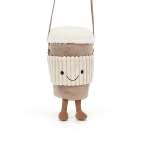 An image of the Jellycat Coffee To Go children's shoulder bag being held from the shoulder strap.
