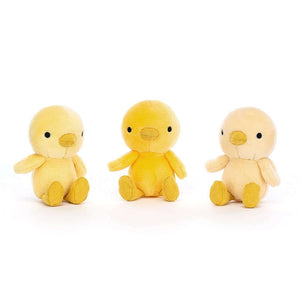 The three baby chickens removed from the next of the Jellycat Nesting Chickies children's soft toy.