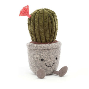 An image of a Silly Succulent Cactus by Jellycat. Silly Succulent is a plush toy designed to look like a cactus. It has green cordy fur, a coral tassel flower, and a big smile. The cactus is sitting in a grey felt pot with cocoa soil and has little cordy legs.