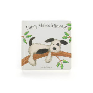 Jellycat Puppy Makes Mischief Book front cover with black and white dog lying on a branch