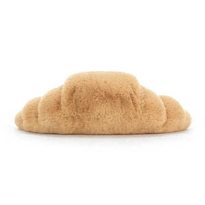 From behind Jellycat Amuseable Croissant children’s soft toy.
