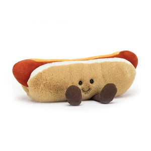 Jellycat Amuseable Hot Dog children’s soft toy is a sausage inside a long bread roll with a smily, happy face and tiny little feet. 