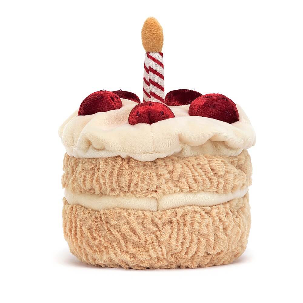 From behind Jellycat Amuseables Birthday Cake children’s soft toy. 