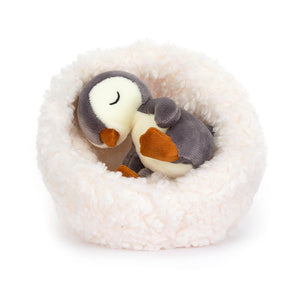 Jellycat Hibernating Penguin is a children’s soft toy which comes with a soft nest. The penguin can sit inside the nest or removed. 