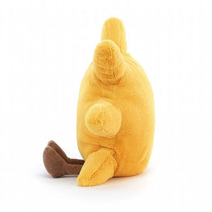 Jellycat Amuseables Sun children’s soft toy sitting to the side with his little brown corded feet in front of him.