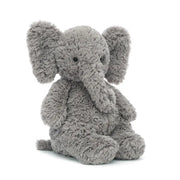 Jellycat Archibald Elephant children’s soft toy is a grey fur covered baby elephant with a trunk, big flappy ears and a tiny little tail. 