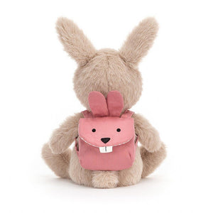 Jellycat Backpack Bunny Rabbit children’s soft toy from behind showing the rabbit shaped backpack she wears on her back. 