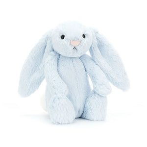 Jellycat bashful bunny in pastel blue. It has long soft fur ears, a furry body and little pink nose.  