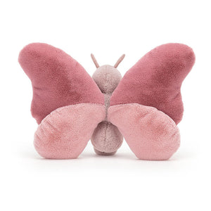From behind Jellycat Beatrice Butterfly children’s soft toys with soft, squishy wings outstretched. 