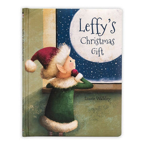 Jellycat hardback children’s book called “Leffy’s Christmas Gift” with an elf looking out of a window. 