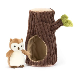 Jellycat Forest Fauna Owl children’s soft toy. The little brown and white owl is on the left and a hollow soft, squishy tree branch is on the right. The owl can be placed inside the tree at bedtime. 