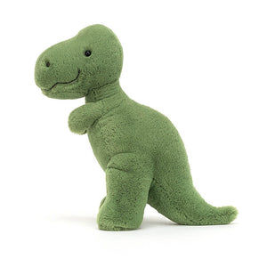 Green fur covered dinosaur soft children’s toy. The Jellycat Fossilly T-Rex stands on his own two short stumpy legs. 