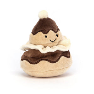 The Jellycat Pretty Patisserie Religieuse is a Chux Bun children’s soft toy. It has a soft cream and chocolate fur and a smile face. 