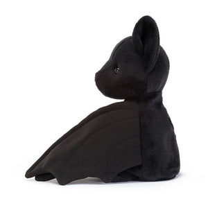 From the side Jellycat Wrapabat children’s soft toy bat.