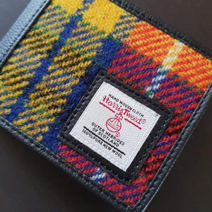 Harris Tweed wWallet in a multicolour tartan of red, yellow and orange. 
