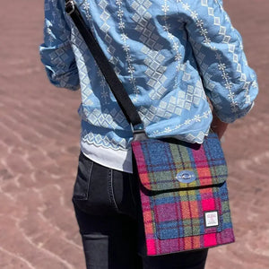 Lady wearing a Maccessori Harris Tweed Satchel Shoulder bag. This one is in a blue, pink and green tartan.