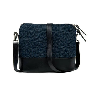 From behind the Maccessori Harris Tweed Square Shoulder Bag with the adjustable shoulder strap draped across the top. 