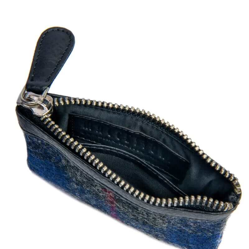 Inside of one of our Harris Tweed coin purses with the top zip open.