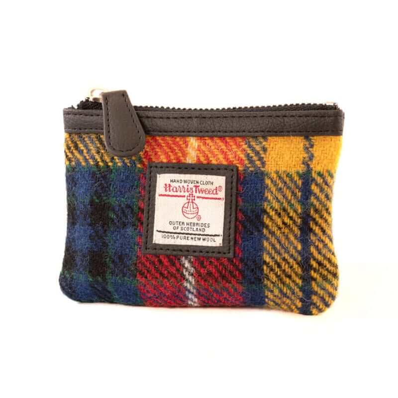 Maccessori Harris Tweed coin purse in a multicolour tartan design of yellow, red, blue and orange.